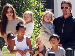 #7011153 The Jolie-Pitt family headed out in New Orleans, Louisiana to do some grocery shopping at a local market on March 20, 2011. Angelina has brought all six children to visit their dad Brad Pitt while he works on his latest project "Cogan's Trade". Maddox, Pax, Zahara and Shiloh walked while the twins Knox and Vivienne hitched a ride from mom and dad who were all smiles while out and about on a lovely sunny day. Brad and Angelina waved to fans as they strolled the street to and from the market. Fame Pictures, Inc - Santa Monica, CA, USA - +1 (310) 395-0500